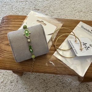 NWT.  Two piece costume jewelry: hoop earrings and bracelet.